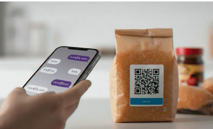 Food packaging with QR code being scanned in a kitchen.